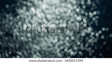 Abstract blue and white bokeh with black Beauty background