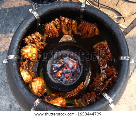 Grilled Pork Intestine In a jar filled with water, Thai style