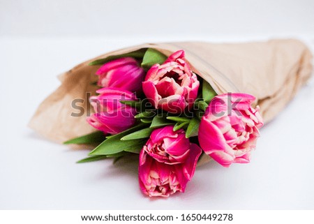 
Beautiful tseti tulips and roses on a light background