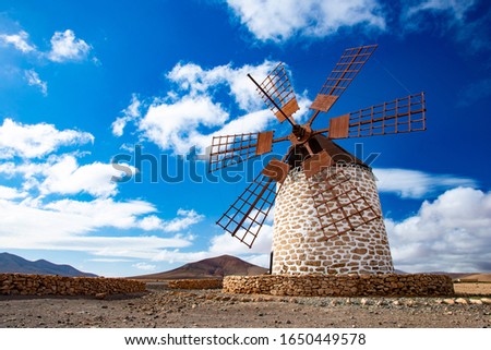 tefia windmill in Fuerteventura with lovely blue sky and clouds.