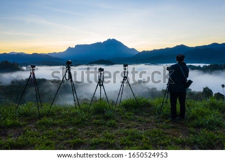 Professional nature photographer capture beautiful nature mountain landscape photos in mountains