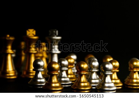 Chess on black background / Chess is a two player strategy board game played on a checkered board