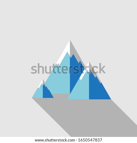 Blue mountain with snow on peak with shadow