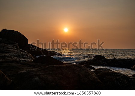 Sunset sea calm evening waves golden hour 