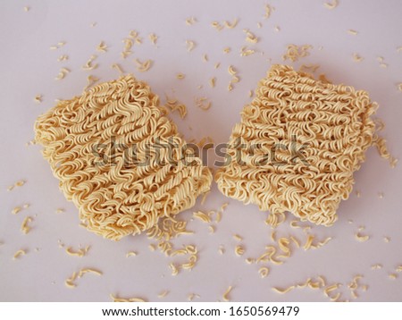 Two instant noodles on white background.