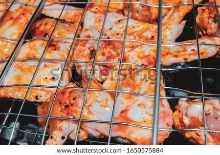 barbecue chicken wings on the grill
