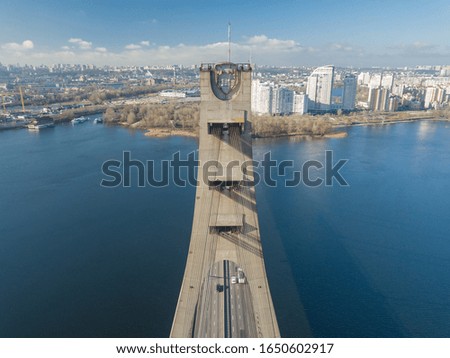 Aerial drone view. The top of the North Bridge over the Dnieper River in Kiev in early spring on a sunny morning.