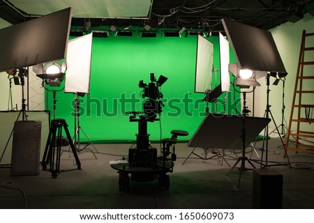 Shooting studio with professional equipment and green screen Royalty-Free Stock Photo #1650609073