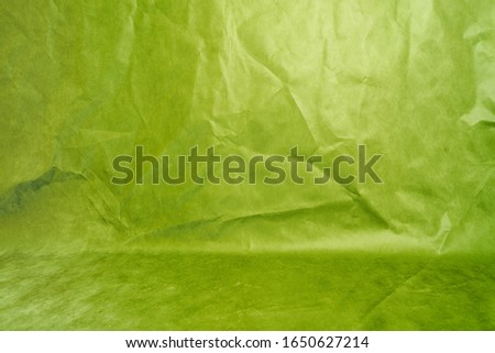 Studio background, backdrop with wall and floor. Background green Studio Portrait Backdrops painted canvas or fabric With folds, crumpled fabric.