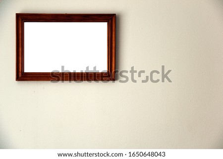 Picture on the wall in a wooden frame