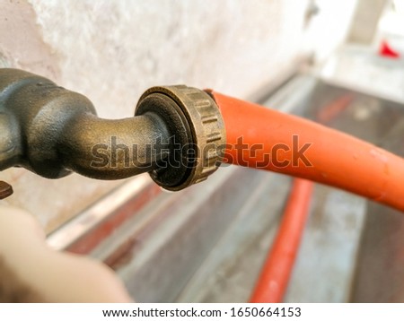 orange color car wash water pipe
