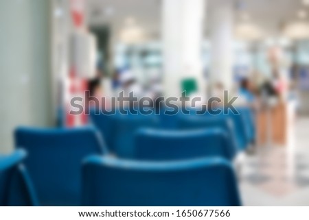 blue chair in in hospital. patient seat in waiting area in clinic. blur background