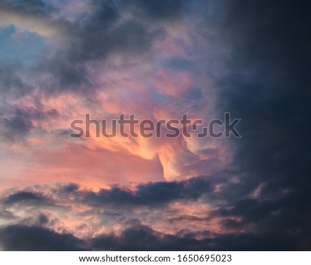Picture of a stormy cloudscape at purple sunset.