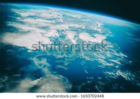 Earth, galaxy and stars.  The elements of this image furnished by NASA.
