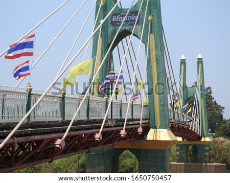 Green bridge in Chum Saeng village  Nakhon Sawan Province Royalty-Free Stock Photo #1650750457