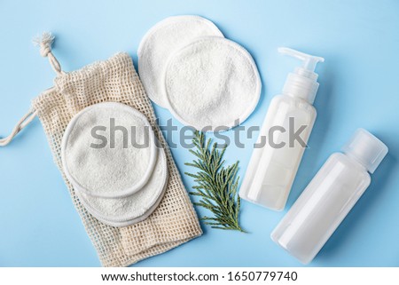 Zero waste, sustainable bathroom and lifestyle. Cotton make-up removal pads, homemade DIY cosmetics in reusable bottles. Royalty-Free Stock Photo #1650779740