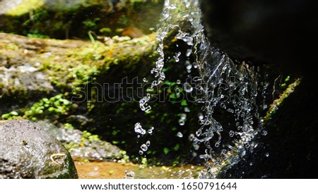 Splash of water running on a river