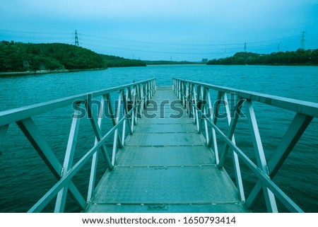 Trestle reaching into the water, waterside, marina
