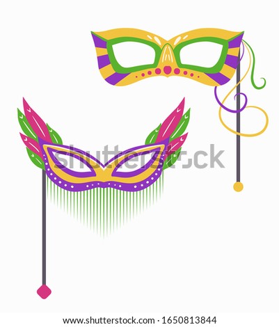 Set of Mardi Gras carnival masks with various decorations on stick. Flat hand drawn holiday object. Festival dressing for the face. Vector object separate from the background.