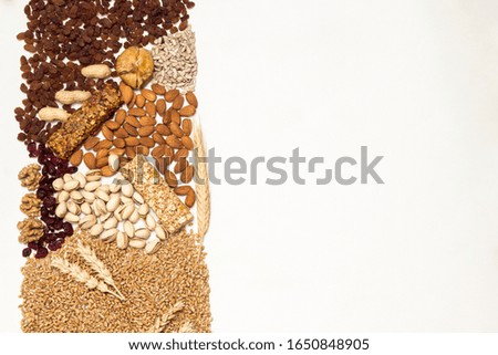 Balanced protein granola bar. Nuts, seeds, cereals. Vegan snack,  Diet Recipe. Flat lay. White background. Copy space

