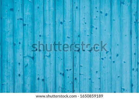 Blue gates made of wooden planks. Background. Copy space.