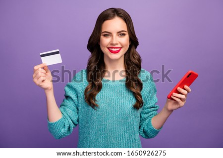 Photo of pretty beautiful manager lady hold telephone hands advising low prices shopping credit card payment wear blue sweater isolated purple color background