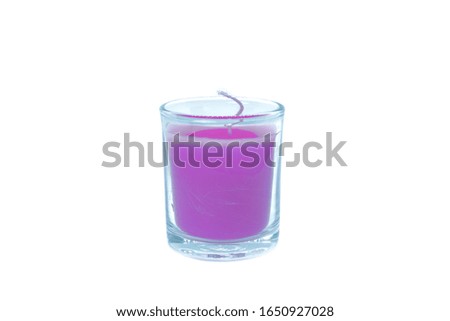 New purple candle On a white background                              