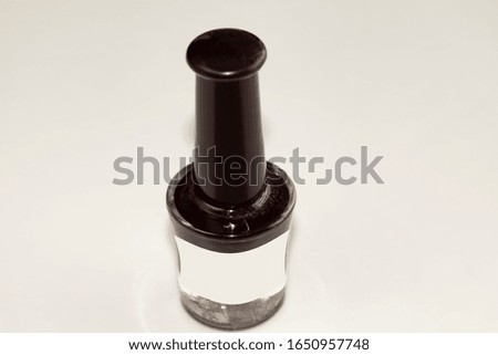 Nail polish on a light background, top view.