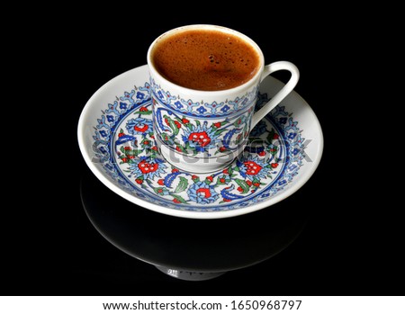 cup of Turkish coffee on black background