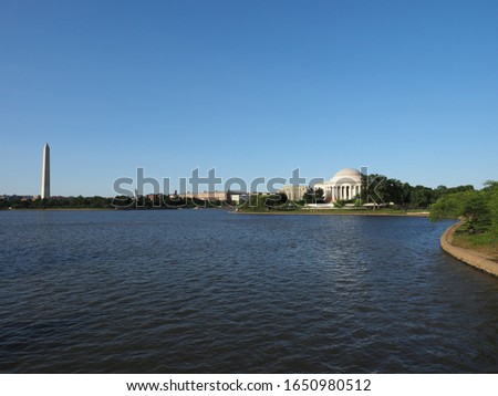 Image of the Washington Monument, the Thomas Jefferson Memorial and the water of the Tidal Basin.