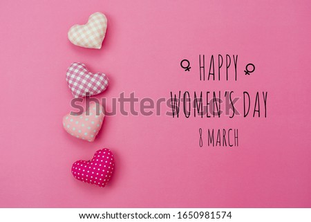 Table top view aerial image of decorations for international women's day  holiday concept background.Flat lay sign of season the word 8 march happy woman's day with heart shape on pink paper.