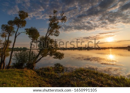 Beautiful summer landscape on the river, with beautiful evening sky.