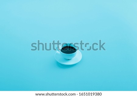 coffee cup in aqua blue background. Minimalism, idea, conceptual images, can easily change the colour tone and put text as a design.