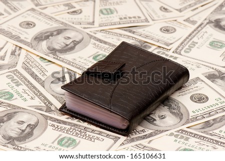 Leather purse cards on background of American money. Studio photo