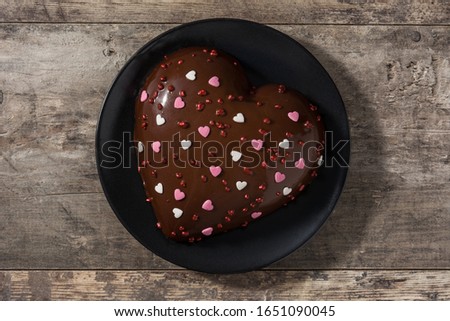 Heart shaped cake for Valentine's Day or Mother's day on on wooden background. Top view