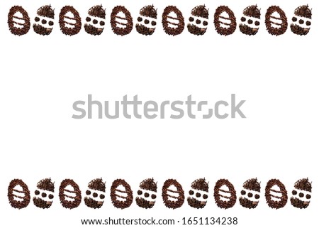Easter egg frame made with roasted coffee beans and dried tea leaves placed on white background from the top view has space for your messages