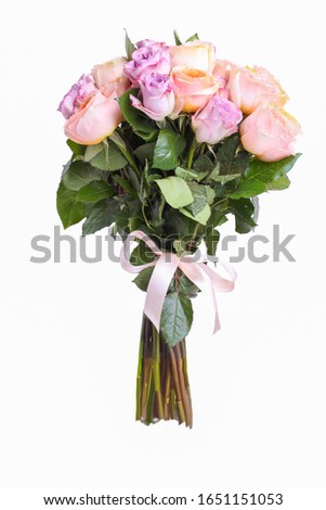 A bouquet of hybrid tea roses and floribunda isolated on a white background.