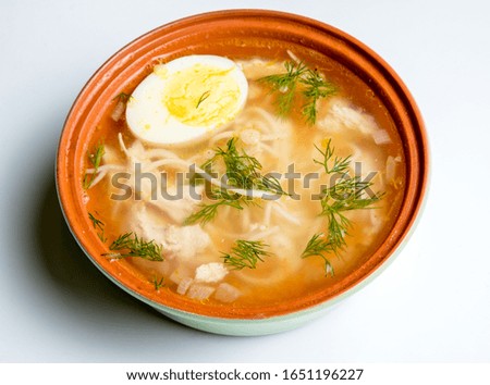 Ceramic Chicken Soup with Homemade Noodles in a Ceramic Cup