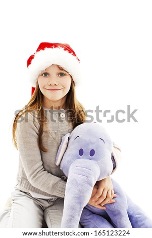 Little girl with Christmas gift.  Isolated on white background 
