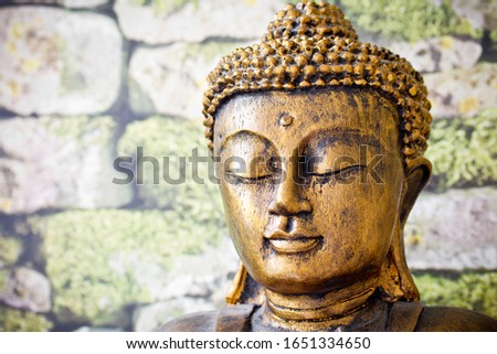 golden buddha pray meditation close up