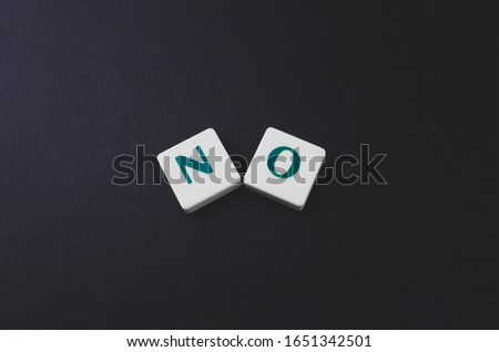 one word no, message with copy space, creative photo on the black background
