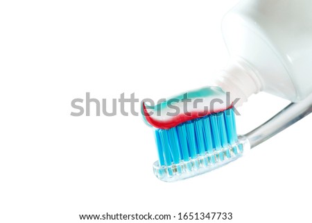 Toothbrush and toothpaste on blurred background. care for the oral cavity and teet.