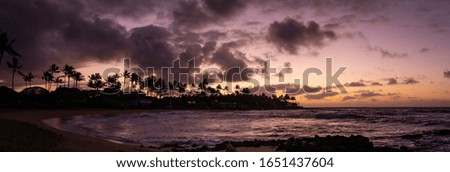 A beautiful sunrise panoramic in Kauai near Poipu. 
