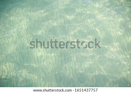 Sea floor with water ripple reflection on the sand