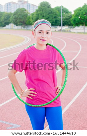 Young lady Playing Hoop Cheerful Exercise Concept
