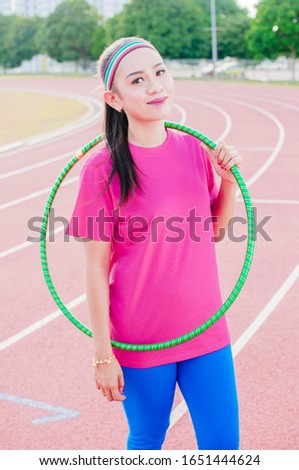 Young lady Playing Hoop Cheerful Exercise Concept