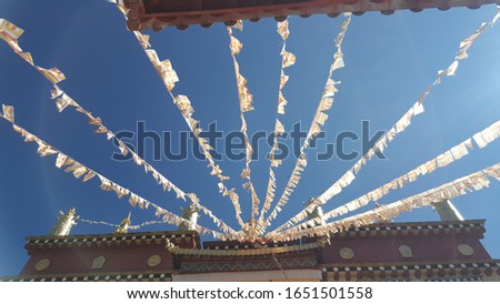 The Tibetan style monastery of Songzanlin Temple in China with prayer flags 