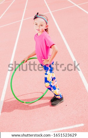 kid girl practice hula hoop