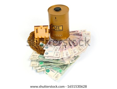 a barrel of oil and a wooden house stands on a pile of Russian banknotes rubles