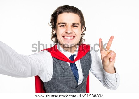 Young businessman with peace gesture take selfie on white background